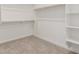 Spacious walk-in closet with ample shelving and hanging space at 20261 W Monterey Way, Buckeye, AZ 85396