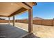 Covered back patio offering a shaded outdoor space perfect for relaxation or entertaining at 20273 W Monterey Way, Buckeye, AZ 85396