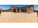 Large backyard with potential for landscaping, featuring covered patio ideal for outdoor living at 20273 W Monterey Way, Buckeye, AZ 85396