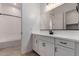 Modern bathroom with double sinks, sleek cabinets, and a large mirror above the vanity at 20273 W Monterey Way, Buckeye, AZ 85396