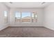 Bright bedroom featuring natural light and neutral carpet at 20273 W Monterey Way, Buckeye, AZ 85396