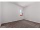 Bright bedroom features neutral carpet and walls, bathed in natural light at 20273 W Monterey Way, Buckeye, AZ 85396