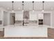 Bright kitchen featuring a large quartz island, stainless steel appliances, and modern pendant lighting at 20273 W Monterey Way, Buckeye, AZ 85396