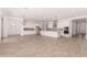 Open concept living area with a kitchen island, stainless appliances and modern lighting at 20273 W Monterey Way, Buckeye, AZ 85396