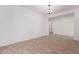 Bright living room with tile flooring and modern lighting fixture at 20273 W Monterey Way, Buckeye, AZ 85396