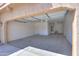 Spacious two-car garage with ample room for parking and storage, and a water heater at 21354 N Denver Ct, Maricopa, AZ 85138