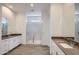 Bathroom featuring dual sinks, a large walk-in shower with glass enclosure, and tile floors at 21949 E Twin Acres Dr, Queen Creek, AZ 85142