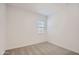 Bedroom featuring neutral carpet, white walls, and a window at 21949 E Twin Acres Dr, Queen Creek, AZ 85142