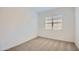 Bright bedroom features neutral carpet, a window with blinds, and fresh, white painted walls at 21949 E Twin Acres Dr, Queen Creek, AZ 85142