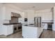 Modern kitchen with stainless steel appliances, a spacious island, and white cabinets at 21949 E Twin Acres Dr, Queen Creek, AZ 85142