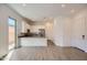 Modern kitchen with stainless appliances, a breakfast bar, white cabinets, and an adjacent dining area at 21949 E Twin Acres Dr, Queen Creek, AZ 85142