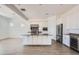 Modern kitchen featuring white cabinetry, stainless steel appliances, and a large center island at 21949 E Twin Acres Dr, Queen Creek, AZ 85142