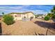 Charming home boasts a quaint backyard with patio, seating area, and low maintenance landscaping at 2263 N Trekell Rd # 81, Casa Grande, AZ 85122