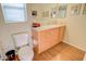 Clean bathroom featuring a single sink vanity, toilet, and drawers, creating a tidy space at 2263 N Trekell Rd # 81, Casa Grande, AZ 85122