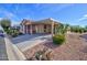 Quaint single-Gathering home boasting a covered carport, xeriscaped yard, and small porch at 2263 N Trekell Rd # 81, Casa Grande, AZ 85122