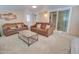 Well-lit living room with comfortable sofas, neutral carpet and bright natural light at 2263 N Trekell Rd # 81, Casa Grande, AZ 85122