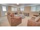 Cozy living room features two sofas, a center table, and natural light from the windows at 2263 N Trekell Rd # 81, Casa Grande, AZ 85122