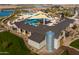 Aerial view of an amenity center featuring a splash pad, pool, playground and other outdoor activities at 23102 E Raven Dr, Queen Creek, AZ 85142