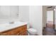 Bathroom featuring a single sink vanity with wood drawers and a tiled backsplash at 2323 W Carson Rd, Phoenix, AZ 85041