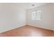 Well-lit bedroom featuring wood floors and white walls, providing a bright and airy atmosphere at 2323 W Carson Rd, Phoenix, AZ 85041