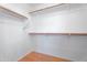 Walk-in closet with wood floors and white walls at 2323 W Carson Rd, Phoenix, AZ 85041