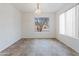 Bright dining room with a large window and neutral walls at 2323 W Carson Rd, Phoenix, AZ 85041