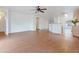 Spacious living room featuring bright, neutral paint, wood-look floors, and a ceiling fan at 2323 W Carson Rd, Phoenix, AZ 85041