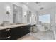 Modern bathroom with dual vanities, stylish lighting, and elegant freestanding tub at 24417 N 87Th St, Scottsdale, AZ 85255