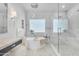 Beautiful bathroom with a soaking tub, glass enclosed shower, and sophisticated lighting at 24417 N 87Th St, Scottsdale, AZ 85255