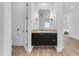 Modern bathroom vanity features sleek black cabinets, marble countertop, and stylish lighting fixtures at 24417 N 87Th St, Scottsdale, AZ 85255