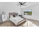 Bright bedroom with a plush bed, a ceiling fan, and natural light from the window at 24417 N 87Th St, Scottsdale, AZ 85255