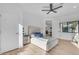 Bright primary bedroom with a ceiling fan and a modern bed offers relaxation and style at 24417 N 87Th St, Scottsdale, AZ 85255