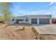 Contemporary stucco home with two-car garage and desert landscaping for a modern aesthetic at 24417 N 87Th St, Scottsdale, AZ 85255