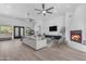 Spacious living room with fireplace, modern decor, and large windows for natural light at 24417 N 87Th St, Scottsdale, AZ 85255