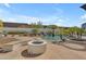 Resort-style backyard with a pool, fire pit, and mature landscaping creating a relaxing environment at 24417 N 87Th St, Scottsdale, AZ 85255