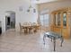 Bright dining room with large china cabinet and matching table set at 25879 W Elizabeth Ave, Buckeye, AZ 85326