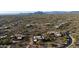 Expansive aerial view showing the neighborhood, mature desert landscaping, and the property's private location at 30600 N Pima Rd # 49, Scottsdale, AZ 85266