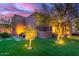 Backyard area featuring a lush lawn, mature trees, and a seating area at 30600 N Pima Rd # 49, Scottsdale, AZ 85266