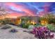 Southwestern style home with desert landscaping, purple cactus and vibrant sunset at 30600 N Pima Rd # 49, Scottsdale, AZ 85266