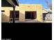 Home under construction featuring bare wood framing and a garage at 3133 W Polk St, Phoenix, AZ 85009