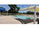 Community pool offers covered seating area with picnic tables for convenient Gathering fun at 3741 W Poinsettia Dr, Phoenix, AZ 85029