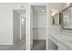 Bathroom featuring a double sink vanity, and quartz countertop, next to a closet at 4634 W Aire Libre Ave, Glendale, AZ 85306