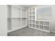 Spacious walk-in closet with built-in shelving and ample storage space, plus a window at 4634 W Aire Libre Ave, Glendale, AZ 85306