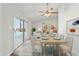 The dining room is virtually staged and features sliding glass doors to the pool area at 4634 W Aire Libre Ave, Glendale, AZ 85306