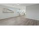 Open floor plan showcases the neutral paint palette and wood-look tile flooring leading into the kitchen at 4634 W Aire Libre Ave, Glendale, AZ 85306