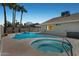 Inviting backyard oasis featuring a sparkling pool and spa, perfect for relaxation and entertainment at 4634 W Aire Libre Ave, Glendale, AZ 85306