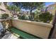 Backyard view of putting green, surrounding desert foliage, and neighboring townhouse exteriors at 4777 S Fulton Ranch Blvd # 1103, Chandler, AZ 85248