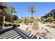 Charming courtyard featuring lush greenery, a stone monument, and paved walkways at 4777 S Fulton Ranch Blvd # 1103, Chandler, AZ 85248