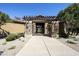 Welcoming stone entrance with a pergola creates a grand arrival to this exceptional home at 4777 S Fulton Ranch Blvd # 1103, Chandler, AZ 85248