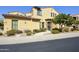 Charming home exterior with desert landscaping, and an inviting front entrance with stone accents at 4777 S Fulton Ranch Blvd # 1103, Chandler, AZ 85248